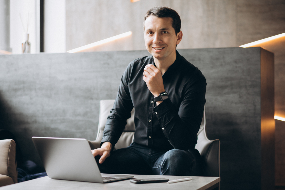 handsome-business-man-working-on-computer-in-office